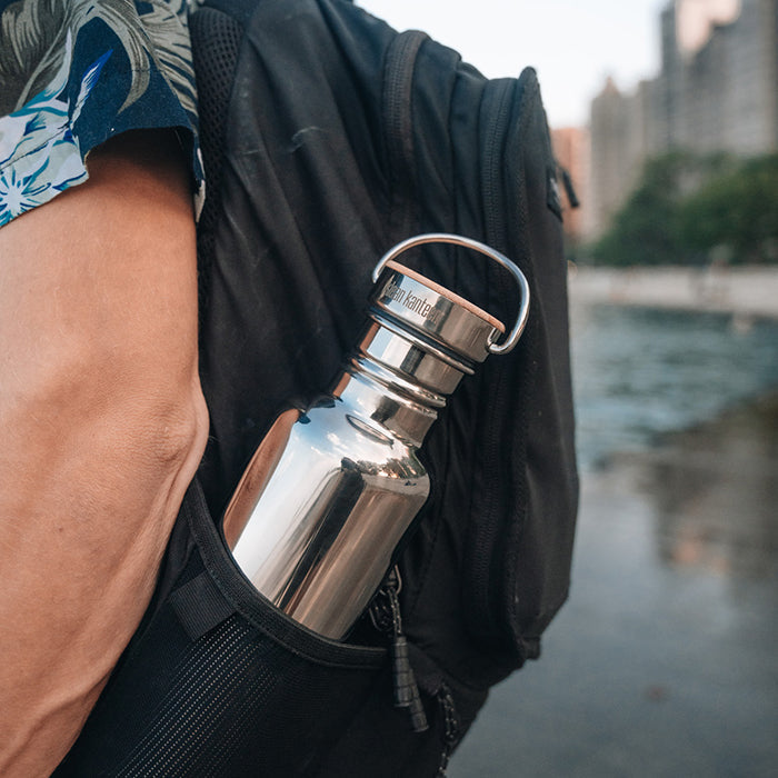27oz-reflect-with-bamboo-cap-t5 K27SSLRF-MS-BAMBOO_reflect-bottle_backpack_lifestyle.jpg